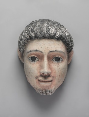  <em>Mummy Mask</em>, 150–200 C.E. Plaster, pigment, 9 7/16 x 7 1/16 x 5 1/2 in. (24 x 18 x 14 cm). Brooklyn Museum, Charles Edwin Wilbour Fund, 05.392. Creative Commons-BY (Photo: , 05.392_PS9.jpg)