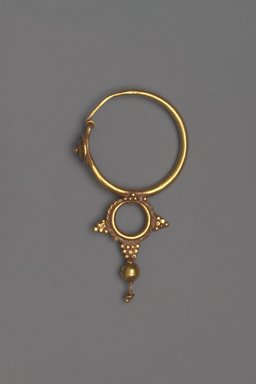 Coptic. <em>Earring with Pendant</em>, 6th century C.E. Gold, 1 13/16 x 15/16 x 1/4 in. (4.6 x 2.4 x 0.6 cm). Brooklyn Museum, Ella C. Woodward Memorial Fund, 05.438. Creative Commons-BY (Photo: Brooklyn Museum, 05.438.jpg)