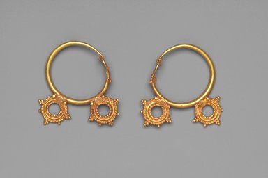  <em>Earrings with Two Wheel Ornaments</em>, 6th century C.E. Gold, .440a: 1 7/16 x 1 3/8 x 5/16 in. (3.7 x 3.5 x 0.8 cm). Brooklyn Museum, Ella C. Woodward Memorial Fund, 05.440a-b. Creative Commons-BY (Photo: Brooklyn Museum, 05.440a-b.jpg)