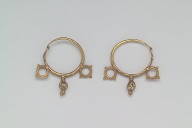  <em>Earrings with Wheel and Pendant Ornaments</em>, 6th century C.E. Gold, 1 3/4 x 1/4 in. (4.4 x 0.6 cm). Brooklyn Museum, Ella C. Woodward Memorial Fund, 05.441a-b. Creative Commons-BY (Photo: Brooklyn Museum, 05.441a-b.jpg)