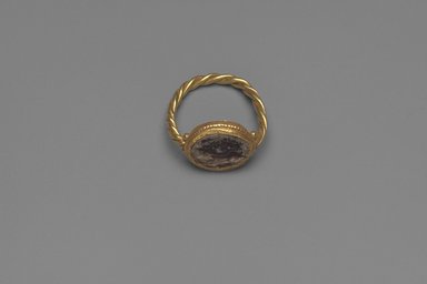 Roman. <em>Finger Ring with Glass Bead</em>, 6th-7th century C.E. Gold, glass, 3/8 x Diam. 3/4 in. (1 x 1.9 cm). Brooklyn Museum, Ella C. Woodward Memorial Fund, 05.534. Creative Commons-BY (Photo: Brooklyn Museum, 05.534.jpg)