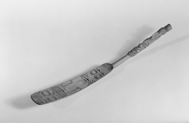 Tlingit. <em>Carved Soapberry Spoon with Flat Spatulate Serving End (Huklishutl)</em>, 1868-1900. Hardwood, 16 9/16 x 1 3/4 x 13/16 in. (42.1 x 4.4 x 2.1 cm). Brooklyn Museum, Museum Expedition 1905, Museum Collection Fund, 05.588.7301. Creative Commons-BY (Photo: Brooklyn Museum, 05.588.7301_acetate_bw.jpg)