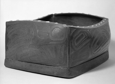 Haida. <em>Bent-corner Box with Killer Whale Design</em>, late 19th–early 20th century. Sea snail opercula, plant fiber, cotton twine, yellow cedar (?), pine (?), 8 1/2 x 19 1/2 x 17 in. (21.6 x 49.5 x 43.2cm). Brooklyn Museum, Museum Expedition 1905, Museum Collection Fund, 05.588.7312. Creative Commons-BY (Photo: Brooklyn Museum, 05.588.7312_bw.jpg)