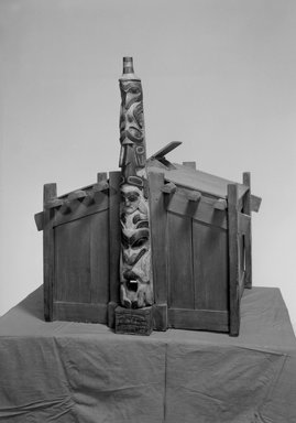 Clads-an-coona (Haida). <em>Model of a Cathins Coons People Box House with Totem Pole Depicting Bear, Skullsit and Whale</em>, late 19th century. Red cedar, pigment, 30 1/8 x 39 3/4 x 33 7/8 in.  (76.5 x 101 x 86 cm). Brooklyn Museum, By exchange, 05.589.7792. Creative Commons-BY (Photo: Brooklyn Museum, 05.589.7792_acetate_bw.jpg)