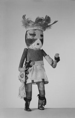 A:shiwi (Zuni Pueblo). <em>Kachina Doll (Eka Ya Tosh Na-kwe)</em>, late 19th century. Wood, cloth, hide, feathers, string, pigment, wool, 14 3/8 x 5 7/8 x 3 7/8 in. (36.5 x 14.9 x 9.8 cm). Brooklyn Museum, Museum Expedition 1907, Museum Collection Fund, 07.467.8396. Creative Commons-BY (Photo: Brooklyn Museum, 07.467.8396_acetate_bw.jpg)