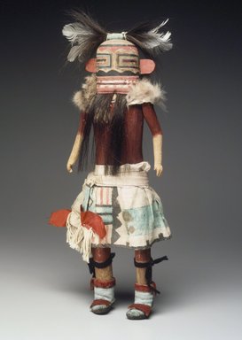 A:shiwi (Zuni Pueblo). <em>Kachina Doll (Helele)</em>, late 19th century. Wood, feather, cotton, fur, pigment, hair, hide, 15 3/8 x 5 7/16 x 2 1/4 in. (39.1 x 13.8 x 5.7 cm). Brooklyn Museum, Museum Expedition 1907, Museum Collection Fund, 07.467.8417. Creative Commons-BY (Photo: Brooklyn Museum, 07.467.8417.jpg)