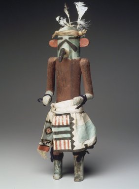 A:shiwi (Zuni Pueblo). <em>Kachina Doll (Kja-kja-lih)</em>, late 19th century. Wood, feather, cotton, pigment, wool yarn, plant fiber, 14 15/16 x 4 13/16 x 4 3/16 in. (37.9 x 12.2 x 10.6 cm). Brooklyn Museum, Museum Expedition 1907, Museum Collection Fund, 07.467.8425. Creative Commons-BY (Photo: Brooklyn Museum, 07.467.8425.jpg)