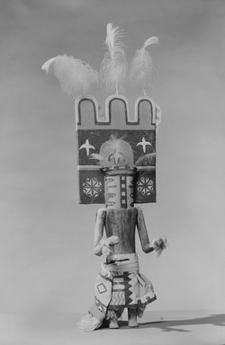 A:shiwi (Zuni Pueblo). <em>Kachina Doll (Homshekwah)</em>, late 19th century. Wood, pigment, feathers, leather, metal, wool yarn, cotton, 21 x 6 3/8 x 3 in. (53.3 x 16.2 x 7.6 cm). Brooklyn Museum, Museum Expedition 1907, Museum Collection Fund, 07.467.8427. Creative Commons-BY (Photo: Brooklyn Museum, 07.467.8427_acetate_bw.jpg)