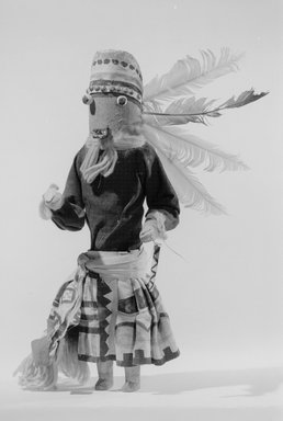 A:shiwi (Zuni Pueblo). <em>Kachina Doll (Ma-hey-ten-na-sha)</em>, late 19th century. Wood, cloth, hide, yarn, string, feather, 5 13/16 x 3 7/16 x 12 3/8 in. (14.8 x 8.7 x 31.4 cm). Brooklyn Museum, Museum Expedition 1907, Museum Collection Fund, 07.467.8430. Creative Commons-BY (Photo: Brooklyn Museum, 07.467.8430_acetate_bw.jpg)