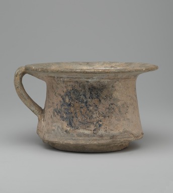  <em>Cup</em>, 13th century. Ceramic; fritware, painted in black and cobalt blue under a transparent glaze; heavy iridescence; rim and handle repaired, 4 x 6 7/8 in. (10.2 x 17.5 cm). Brooklyn Museum, Museum Collection Fund, 08.23. Creative Commons-BY (Photo: Brooklyn Museum, 08.23_side2_PS2.jpg)