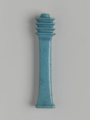  <em>Djed-Column Amulet</em>, 664–525 B.C.E. Faience, 3 3/4 x 13/16 x 1/2 in. (9.5 x 2.1 x 1.3 cm). Brooklyn Museum, Charles Edwin Wilbour Fund, 08.480.128. Creative Commons-BY (Photo: Brooklyn Museum, 08.480.128_front_PS1.jpg)