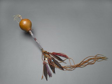 Osage. <em>Peyote Gourd</em>, late 19th-early 20th century. Gourd, glass beads, metal, feathers, brass, sinew, nut or seed, cork, 27 9/16 x 2 3/4 in. (70 x 7 cm). Brooklyn Museum, Museum Expedition 1911, Museum Collection Fund, 11.694.9059. Creative Commons-BY (Photo: Brooklyn Museum, 11.694.9059_PS2.jpg)