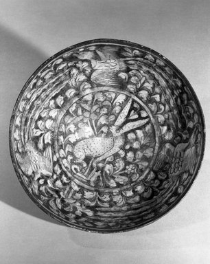  <em>Bowl with Hare and Flying Simurghs (Phoenixes)</em>, 14th century. Ceramic, "Sultanabad" ware; fritware, painted in cobalt blue and black under a transparent glaze, 3 13/16 x 8 1/4 in. (9.7 x 21 cm). Brooklyn Museum, Gift of Robert B. Woodward, 12.57. Creative Commons-BY (Photo: Brooklyn Museum, 12.57_view2_acetate_bw.jpg)