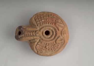  <em>Lamp</em>, 100 B.C.E.-30 C.E. Terracotta, 2 1/2 x 3 1/8 in. (6.3 x 8 cm). Brooklyn Museum, Gift of the Egypt Exploration Society, 12.911.5. Creative Commons-BY (Photo: Brooklyn Museum, 12.911.5_top.jpg)