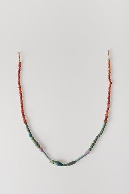  <em>Single-strand Necklace</em>, ca. 2008–1630 B.C.E. Faience, amethyst, carnelian, As strung, greatest diam. 1/4 × 17 5/16 in. (0.7 × 44 cm). Brooklyn Museum, Gift of the Egypt Exploration Society, 12.911.6. Creative Commons-BY (Photo: Brooklyn Museum, 12.911.6_overall_PS20.jpg)