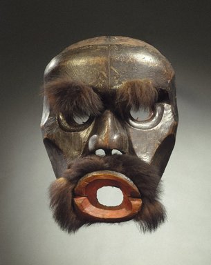 Kwakwaka'wakw. <em>Dzunuk'wa Cannibal Woman Mask</em>, 19th century. Cedar wood, fur (black bear?), hide, pigment, iron nails, 19 1/2 x 14 x 7 3/4 in. (49.5 x 35.6 x 19.7 cm). Brooklyn Museum, Gift of Herman Stutzer, Esq., 15.513.1. Creative Commons-BY (Photo: Brooklyn Museum, 15.513.1_SL1.jpg)