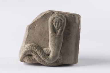  <em>Relief Fragment of a Human-headed Cobra</em>, 332 B.C.E.–100 C.E. Limestone (?), 2 5/16 × 2 9/16 × 1 5/8 in. (5.8 × 6.5 × 4.2 cm). Brooklyn Museum, Gift of Evangeline Wilbour Blashfield, Theodora Wilbour, and Victor Wilbour honoring the wishes of their mother, Charlotte Beebe Wilbour, as a memorial to their father, Charles Edwin Wilbour, 16.109. Creative Commons-BY (Photo: Brooklyn Museum, 16.109_PS22.jpg)