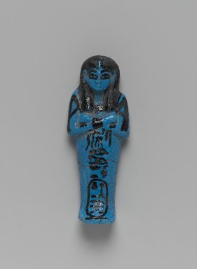  <em>Shabty of Queen Henuttawy</em>, ca. 1075–945 B.C.E. Faience, 4 3/4 x 1 3/4 x 1 in. (12.1 x 4.4 x 2.5 cm). Brooklyn Museum, Gift of Evangeline Wilbour Blashfield, Theodora Wilbour, and Victor Wilbour honoring the wishes of their mother, Charlotte Beebe Wilbour, as a memorial to their father, Charles Edwin Wilbour, 16.188. Creative Commons-BY (Photo: Brooklyn Museum, 16.188_front_PS2.jpg)