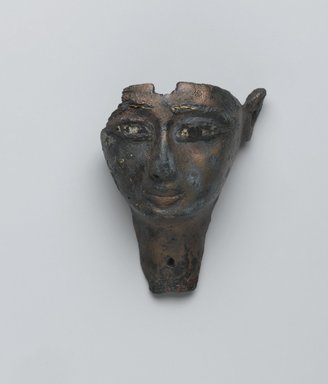  <em>Face from a Composite Statue</em>, ca. 1075–656 B.C.E. Bronze, stone?, gold, 1 5/8 x 2 1/16 x 2 13/16 in. (4.1 x 5.3 x 7.2 cm). Brooklyn Museum, Gift of Evangeline Wilbour Blashfield, Theodora Wilbour, and Victor Wilbour honoring the wishes of their mother, Charlotte Beebe Wilbour, as a memorial to their father, Charles Edwin Wilbour, 16.198. Creative Commons-BY (Photo: Brooklyn Museum, 16.198_front_PS2.jpg)