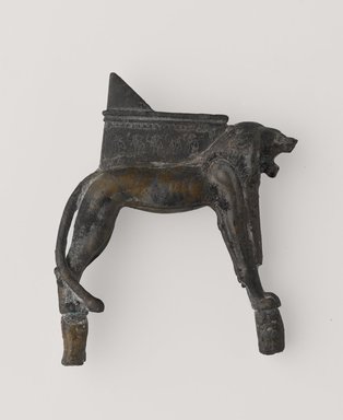  <em>Lion-Shaped Support for a Throne</em>, 664-525 B.C.E. Bronze, gold, 3 1/16 x 2 3/16 in. (7.7 x 5.5 cm). Brooklyn Museum, Gift of Evangeline Wilbour Blashfield, Theodora Wilbour, and Victor Wilbour honoring the wishes of their mother, Charlotte Beebe Wilbour, as a memorial to their father, Charles Edwin Wilbour, 16.261. Creative Commons-BY (Photo: Brooklyn Museum, 16.261_PS9.jpg)