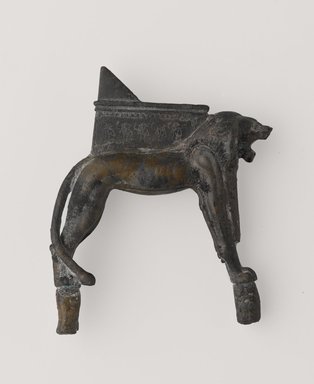  <em>Lion-Shaped Support for a Throne</em>, 664–525 B.C.E. Bronze, gold, 3 1/16 x 2 3/16 in. (7.7 x 5.5 cm). Brooklyn Museum, Gift of Evangeline Wilbour Blashfield, Theodora Wilbour, and Victor Wilbour honoring the wishes of their mother, Charlotte Beebe Wilbour, as a memorial to their father, Charles Edwin Wilbour, 16.261. Creative Commons-BY (Photo: Brooklyn Museum, 16.261_PS9.jpg)