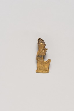  <em>Amulet in the Form of a Seated Mummified King</em>, ca. 1539-1075 B.C.E. Gold, 3/8 x 7/8 in. (0.9 x 2.3 cm) . Brooklyn Museum, Gift of Evangeline Wilbour Blashfield, Theodora Wilbour, and Victor Wilbour honoring the wishes of their mother, Charlotte Beebe Wilbour, as a memorial to their father, Charles Edwin Wilbour, 16.323. Creative Commons-BY (Photo: Brooklyn Museum, 16.323_PS20.jpg)