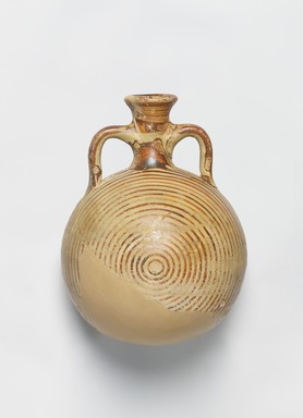 Mycenaean. <em>Pilgrim Flask</em>, ca. 1425–1300 B.C.E. Clay, slip, 5 5/16 × Diam. 3 11/16 in. (13.5 × 9.3 cm). Brooklyn Museum, Gift of Evangeline Wilbour Blashfield, Theodora Wilbour, and Victor Wilbour honoring the wishes of their mother, Charlotte Beebe Wilbour, as a memorial to their father, Charles Edwin Wilbour, 16.43. Creative Commons-BY (Photo: , 16.43_PS11.jpg)