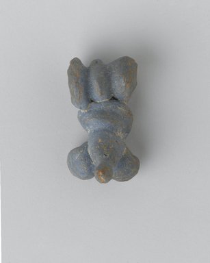  <em>Phallus and Testicles as Amulet</em>, 305 B.C.E.-395 C.E. Faience, 1/2 x 1/2 x 7/8 in. (1.3 x 1.2 x 2.3 cm). Brooklyn Museum, Gift of Evangeline Wilbour Blashfield, Theodora Wilbour, and Victor Wilbour honoring the wishes of their mother, Charlotte Beebe Wilbour, as a memorial to their father Charles Edwin Wilbour, 16.580.17. Creative Commons-BY (Photo: Brooklyn Museum, 16.580.17_front_PS2.jpg)