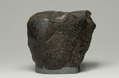 Egyptian. <em>Fragment from Statue of Montuemhat</em>, ca. 1075-656 B.C.E. Granite, 5 1/2 × 7 × 4 in. (14 × 17.8 × 10.2 cm). Brooklyn Museum, Gift of Evangeline Wilbour Blashfield, Theodora Wilbour, and Victor Wilbour honoring the wishes of their mother, Charlotte Beebe Wilbour, as a memorial to their father, Charles Edwin Wilbour, 16.580.186. Creative Commons-BY (Photo: Brooklyn Museum, 16.580.186_front_PS11.jpg)