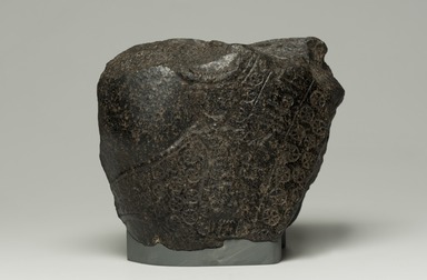 Egyptian. <em>Fragment from Statue of Montuemhat</em>, ca. 1075–656 B.C.E. Granite, 5 1/2 × 7 × 4 in. (14 × 17.8 × 10.2 cm). Brooklyn Museum, Gift of Evangeline Wilbour Blashfield, Theodora Wilbour, and Victor Wilbour honoring the wishes of their mother, Charlotte Beebe Wilbour, as a memorial to their father, Charles Edwin Wilbour, 16.580.186. Creative Commons-BY (Photo: Brooklyn Museum, 16.580.186_front_PS11.jpg)