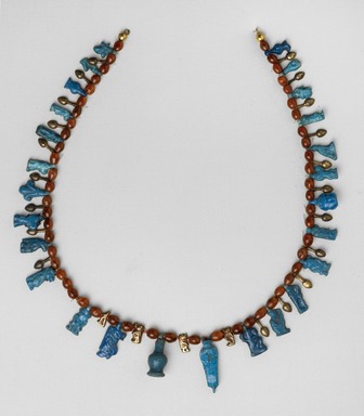  <em>Necklace with Bes and Taweret Pendants</em>, ca. 1539-1292 B.C.E. Gold, faience, carnelian, 1 1/16 x 14 15/16 in. (2.7 x 38 cm). Brooklyn Museum, Gift of Evangeline Wilbour Blashfield, Theodora Wilbour, and Victor Wilbour honoring the wishes of their mother, Charlotte Beebe Wilbour, as a memorial to their father Charles Edwin Wilbour, 16.580.201. Creative Commons-BY (Photo: Brooklyn Museum, 16.580.201_edited_PS4.jpg)