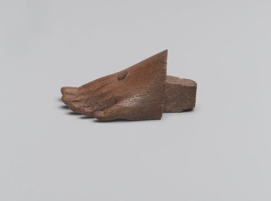  <em>Front Part of Left Foot</em>, 2500-332 B.C. Wood (sycamore fig), 13/16 x 1 1/16 x 1 7/8 in. (2 x 2.7 x 4.8 cm). Brooklyn Museum, Gift of Evangeline Wilbour Blashfield, Theodora Wilbour, and Victor Wilbour honoring the wishes of their mother, Charlotte Beebe Wilbour, as a memorial to their father Charles Edwin Wilbour, 16.580.459. Creative Commons-BY (Photo: Brooklyn Museum, 16.580.459_profile_left_PS2.jpg)
