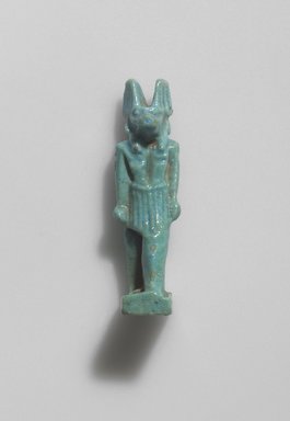  <em>Figure of Anubis Standing</em>. Faience, 1 7/16 x 9/16 in. (3.7 x 1.5 cm). Brooklyn Museum, Gift of Evangeline Wilbour Blashfield, Theodora Wilbour, and Victor Wilbour honoring the wishes of their mother, Charlotte Beebe Wilbour, as a memorial to their father, Charles Edwin Wilbour, 16.580.56. Creative Commons-BY (Photo: Brooklyn Museum, 16.580.56.jpg)