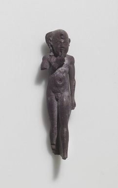  <em>Figure of the Child Horus Standing</em>, 664–525 B.C.E. Faience, 2 1/2 × 11/16 × 5/8 in. (6.3 × 1.7 × 1.6 cm). Brooklyn Museum, Gift of Evangeline Wilbour Blashfield, Theodora Wilbour, and Victor Wilbour honoring the wishes of their mother, Charlotte Beebe Wilbour, as a memorial to their father Charles Edwin Wilbour, 16.580.61. Creative Commons-BY (Photo: Brooklyn Museum, 16.580.61.jpg)