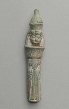  <em>Head on Column as Amulet</em>, 664-525 B.C.E. Faience, 2 3/4 x Diam. 9/16 in. (7 x 1.5 cm). Brooklyn Museum, Gift of Evangeline Wilbour Blashfield, Theodora Wilbour, and Victor Wilbour honoring the wishes of their mother, Charlotte Beebe Wilbour, as a memorial to their father Charles Edwin Wilbour, 16.580.71. Creative Commons-BY (Photo: Brooklyn Museum, 16.580_front_PS6.jpg)