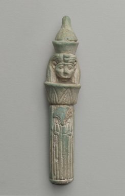  <em>Head on Column as Amulet</em>, 664–525 B.C.E. Faience, 2 3/4 x Diam. 9/16 in. (7 x 1.5 cm). Brooklyn Museum, Gift of Evangeline Wilbour Blashfield, Theodora Wilbour, and Victor Wilbour honoring the wishes of their mother, Charlotte Beebe Wilbour, as a memorial to their father Charles Edwin Wilbour, 16.580.71. Creative Commons-BY (Photo: Brooklyn Museum, 16.580_front_PS6.jpg)