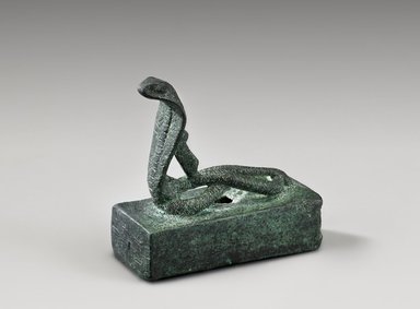  <em>Snake Coffin (Atum)</em>, 664–343 B.C.E. Bronze, lead, 2 15/16 x 1 7/16 x 3 1/8 in. (7.5 x 3.6 x 7.9 cm). Brooklyn Museum, Gift of Evangeline Wilbour Blashfield, Theodora Wilbour, and Victor Wilbour honoring the wishes of their mother, Charlotte Beebe Wilbour, as a memorial to their father, Charles Edwin Wilbour, 16.600. Creative Commons-BY (Photo: Brooklyn Museum (Gavin Ashworth,er), 16.600_Gavin_Ashworth_photograph.jpg)