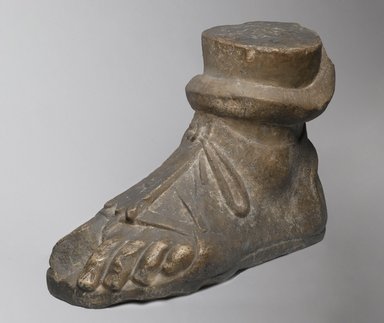 Roman. <em>Colossal Left Foot</em>, 1st-2nd century C.E. Marble, 13 x 7 7/8 x 18 1/2 in. (33 x 20 x 47 cm). Brooklyn Museum, Robert B. Woodward Memorial Fund, 19.170. Creative Commons-BY (Photo: Brooklyn Museum, 19.170_threequarter_left_PS2.jpg)