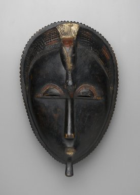 Baule. <em>Mblo Portrait Mask</em>, late 19th–early 20th century. Wood, pigment, 13 3/8 x 8 7/16 x 6 1/8 in. (34 x 21.5 x 15.5 cm). Brooklyn Museum, The Adolph and Esther D. Gottlieb Collection, 1989.51.15. Creative Commons-BY (Photo: Brooklyn Museum, 1989.51.15_front_PS2.jpg)