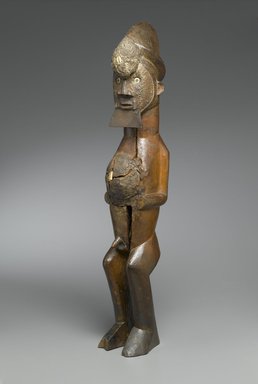 Master of Mayama. <em>Figure of Standing Male (Nkisi)</em>, late 19th century. Wood, shell, mud, metal, resin, organic materials, imported buttons, 25 1/2 x 4 1/4 x 4 3/4 in. (64.8 x 10.8 x 12.1 cm). Brooklyn Museum, The Adolph and Esther D. Gottlieb Collection, 1989.51.19. Creative Commons-BY (Photo: Brooklyn Museum, 1989.51.19_PS2.jpg)