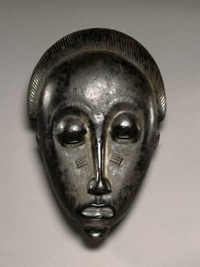 Baule. <em>Mblo Portrait Mask</em>, late 19th or early 20th century. Wood, oils, pigment, 10 1/2 x 5 3/8 x 3 in.(26.7 x 13.7 x 7.6 cm). Brooklyn Museum, The Adolph and Esther D. Gottlieb Collection, 1989.51.25. Creative Commons-BY (Photo: Brooklyn Museum, 1989.51.25_SL1.jpg)