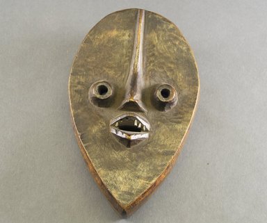 Dan. <em>Mask</em>, 20th century. Wood, metal, 7 7/8 x 4 7/8 x 1 3/4 in. (20 x 12.4 x 4.4 cm). Brooklyn Museum, The Adolph and Esther D. Gottlieb Collection, 1989.51.26. Creative Commons-BY (Photo: Brooklyn Museum, 1989.51.26_front_PS5.jpg)