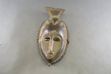 Baule. <em>Mask with Serrated Edge</em>, 20th century. Wood, pigment, 12 1/4 x 6 1/4 x 3 in. Brooklyn Museum, The Adolph and Esther D. Gottlieb Collection, 1989.51.28. Creative Commons-BY (Photo: Brooklyn Museum, 1989.51.28_front_PS5.jpg)