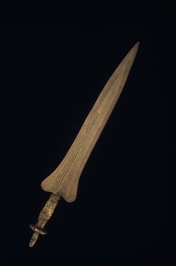 Lokele. <em>Double Edged Knife</em>, 19th or 20th century. Iron, wood, fiber, 25 x 4 x 2 in.  (63.5 x 10.2 x 5.1 cm). Brooklyn Museum, The Adolph and Esther D. Gottlieb Collection, 1989.51.29. Creative Commons-BY (Photo: Brooklyn Museum, 1989.51.29.jpg)