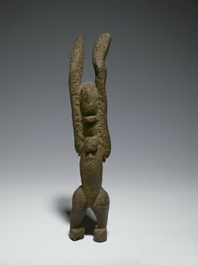 Dogon. <em>Nommo Figure with Raised Arms</em>, 11th–15th century (possibly). Wood, organic sacrificial materials, 10 1/2 x 2 7/8 x 1 3/4 in. (26.7 x 7.3 x 4.4 cm). Brooklyn Museum, The Adolph and Esther D. Gottlieb Collection, 1989.51.39. Creative Commons-BY (Photo: Brooklyn Museum, 1989.51.39_PS6.jpg)