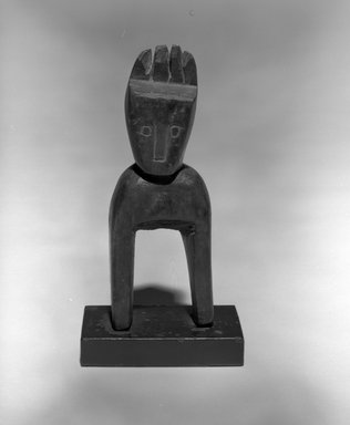 Baule. <em>Heddle Pulley with Head</em>, 20th century. Wood, 7 3/4 x 2 3/4 x 1 1/2 in. Brooklyn Museum, The Adolph and Esther D. Gottlieb Collection, 1989.51.53. Creative Commons-BY (Photo: Brooklyn Museum, 1989.51.53_bw.jpg)