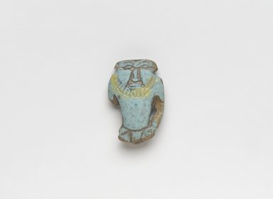  <em>Bes Amulet</em>, ca. 1836-1700 B.C.E. Faience, 1 1/4 x 13/16 x 3/8 in. (3.2 x 2.1 x 1 cm). Brooklyn Museum, Gift of Ariane, Nike, and Samara Mele, 1990.13. Creative Commons-BY (Photo: , 1990.13_PS9.jpg)