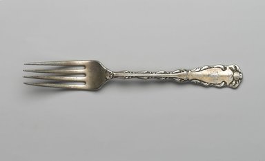 Reed & Barton (American, 1840-present). <em>Dinner Fork, Rex Pattern</em>, Patented 1894. Silver plate, 7 11/16 x 1 1/8 x 7/8 in. (19.5 x 2.8 x 2.2 cm). Brooklyn Museum, Gift of Mrs. Nathan L. Burnett, 1990.141.15. Creative Commons-BY (Photo: Brooklyn Museum, 1990.141.15_PS2.jpg)