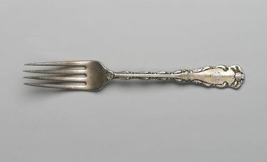 Reed & Barton (American, 1840–present). <em>Dinner Fork, Rex Pattern</em>, Patented 1894. Silver plate, 7 11/16 x 1 1/8 x 7/8 in. (19.5 x 2.8 x 2.2 cm). Brooklyn Museum, Gift of Mrs. Nathan L. Burnett, 1990.141.15. Creative Commons-BY (Photo: Brooklyn Museum, 1990.141.15_PS2.jpg)