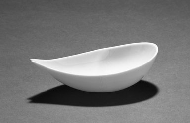 Eva Zeisel (American, born Hungary, 1906-2011). <em>Sauce Boat or Nut Dish</em>, ca. 1946-1947. Porcelain, 1 1/2 x 5 1/16 x 2 38 in.  (3.8 x 12.9 x 0 cm). Brooklyn Museum, Gift of Daniel Morris and Denis Gallion, 1990.194.6. Creative Commons-BY (Photo: Brooklyn Museum, 1990.194.6_bw.jpg)